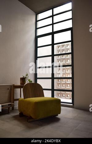 armchair, chair, individual sofa, solid natural wood structure, seat and back in fabric Stock Photo