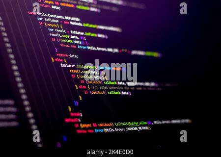 Compressed colorful Code background. Web programming with Javascript coding Stock Photo