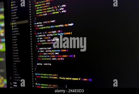 Compressed colorful Code background. Web programming with Javascript coding Stock Photo