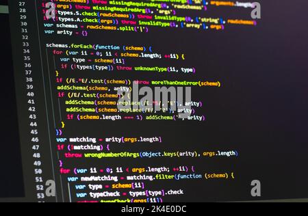 Compressed colorful Code background. Web programming with Javascript coding Stock Photo