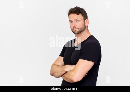 Handsome man in black portrait against white background Stock Photo