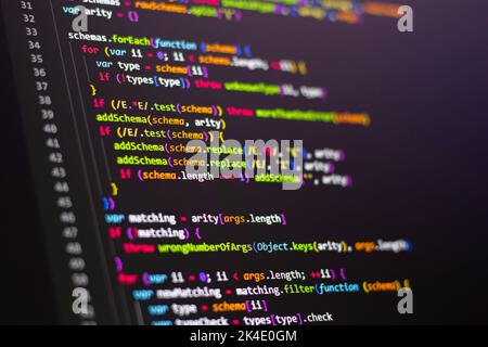 Compressed colorful Code background. Web programming with Javascript coding Stock Photo