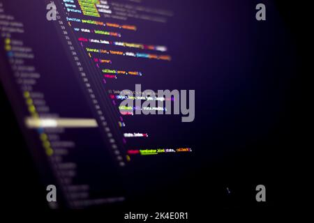 Compressed colorful Code background. Web programming with Javascript coding Stock Photo