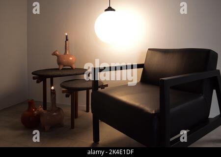 armchair, chair, individual sofa, solid natural wood structure, seat and back in natural leather Stock Photo