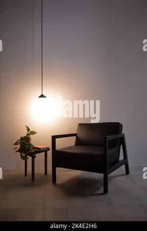 armchair, chair, individual sofa, solid natural wood structure, seat and back in natural leather Stock Photo