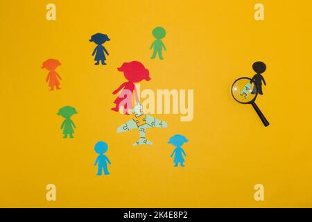 businesswoman and her business team are working on a creative project, putting together a puzzle that will take them to the heights Stock Photo