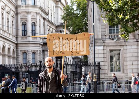 London, UK. 01st Oct, 2022. A man stands with a placard saying England Dont Be Rasist in front of Downing Street. Credit: SOPA Images Limited/17�Թ����� Live News Stock Photo