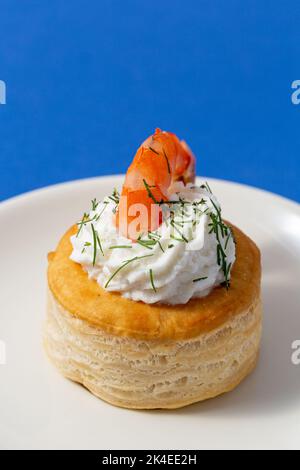 vol au vent with fish on blue background Stock Photo