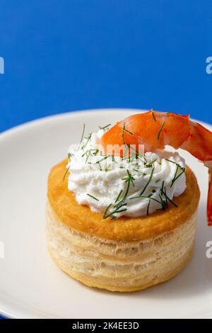 vol au vent with fish on blue background Stock Photo