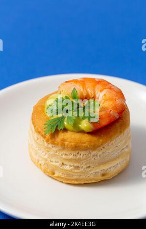 vol au vent with fish on blue background Stock Photo