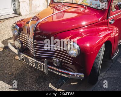 Loriol sur Drome, France - 17 September, 2022: Vintage red cabriolet Renault 4 CV, on the street. Classic car exhibition in Loriol sur Drome, France. Stock Photo