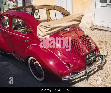 Loriol sur Drome, France - 17 September, 2022: Vintage red cabriolet Renault 4 CV, on the street. Classic car exhibition in Loriol sur Drome, France. Stock Photo