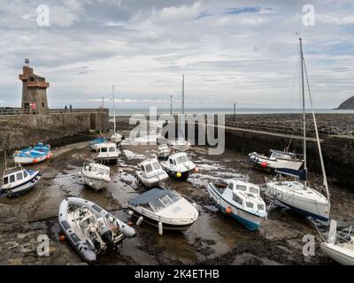 LYNMOUTH, DEVON, SEPTEMBER 11 2022: Boats in Lynmouth harbour at low tide. Stock Photo