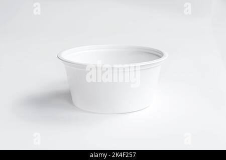 White plastic cup disposable catchup bowl isolated on white background. Front view, mockup Stock Photo