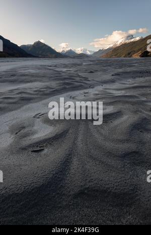 Delicate patterns of rock silt line the the Dart River in Glenorchy, known famously for the filming location of Isengard in the Lord of the Rings. Stock Photo