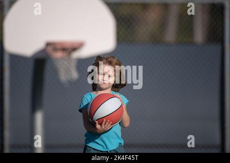Premium Photo  Kid playing basketball with basket ball laughing and having  fun top view