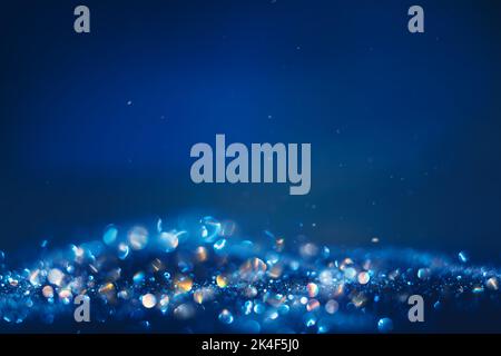 Shining n darkness defocused pearl glitter. Christmas and winter holidays background Stock Photo