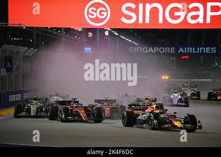 Singapore. 2nd Oct, 2022. Red Bull's Mexican driver Sergio Perez (1st R Front) drives during the Formula One Singapore Grand Prix Night Race at the Marina Bay Street Circuit in Singapore on Oct. 2, 2022. Credit: Then Chih Wey/Xinhua/Alamy Live News Stock Photo