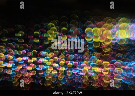 A futuristic multicolored bokeh ray. Stock Photo