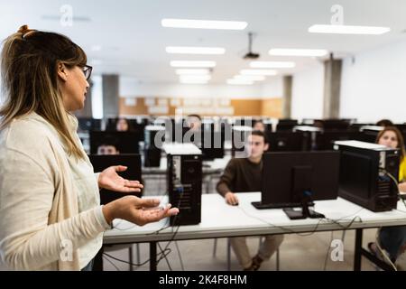 Hispanic teacher doing lecture in high school - Education concept Stock Photo