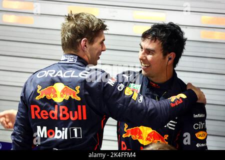 Singapore, Singapore. 02nd Oct, 2022. (L to R): Max Verstappen (NLD) Red Bull Racing celebrates in parc ferme with race winner and team mate Sergio Perez (MEX) Red Bull Racing. 02.10.2022. Formula 1 World Championship, Rd 17, Singapore Grand Prix, Marina Bay Street Circuit, Singapore, Race Day. Photo credit should read: XPB/Press Association Images. Credit: XPB Images Ltd/Alamy Live News Stock Photo