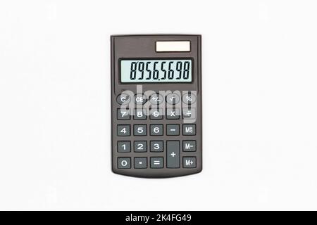 Calculator with big buttons with numbers on the digital screen on a white background. Isolated. Solar powered financial calculator. Electronic machine Stock Photo
