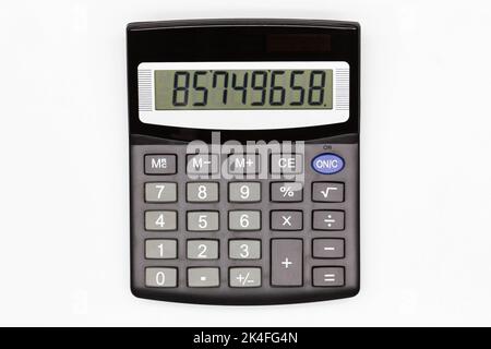 Calculator with big buttons with numbers on the digital screen on a white background. Isolated. Solar powered financial calculator. Electronic machine Stock Photo