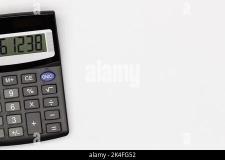 Calculator with big buttons with numbers on the digital screen on a white background. Isolated. Solar powered financial calculator. Math Electronic Stock Photo