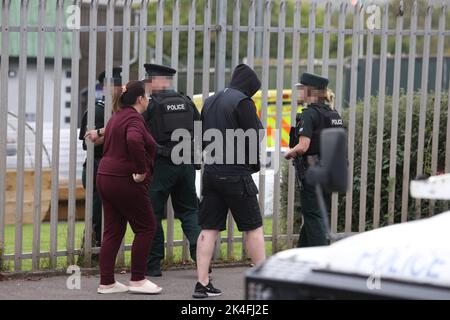 EDITORS NOTE IMAGE PIXELLATED BY THE PA PICTURE DESK PSNI officers at the scene following a shooting at the clubhouse of Donegal Celtic Football Club, in west Belfast. Picture date: Sunday October 2, 2022. Stock Photo