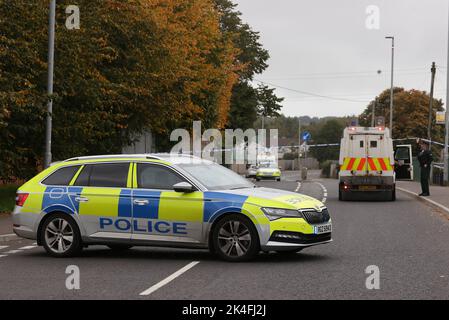 EDITORS NOTE IMAGE PIXELLATED BY THE PA PICTURE DESK Police vehicles at the scene following a shooting at the clubhouse of Donegal Celtic Football Club, in west Belfast. Picture date: Sunday October 2, 2022. Stock Photo