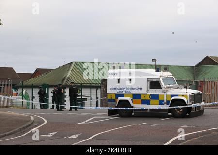 EDITORS NOTE IMAGE PIXELLATED BY THE PA PICTURE DESK FOR THE PROTECTION OF OFFICERS OF THE PSNI Officers from the PSNI at the scene following a shooting at the clubhouse of Donegal Celtic Football Club, in west Belfast. Picture date: Sunday October 2, 2022. Stock Photo