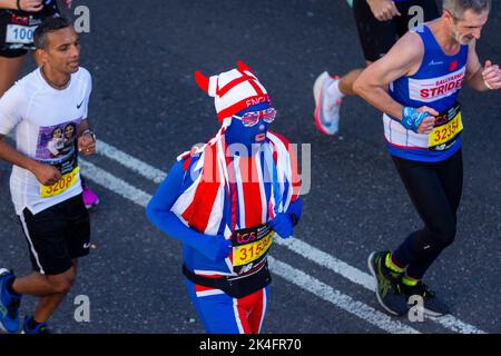 London, UK.  2 October 2022. A costumed runner near Blackfriars takes part in the TCS London Marathon.  The 42nd event is this year sponsored by Tata Consultancy Services (TCS).  40,000 elite athletes, club runners and fun runners are taking part in the mass event.  In 2023, the race will return to its usual April date in the calendar.  Credit: Stephen Chung / Alamy Live News Stock Photo