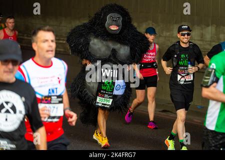 London, UK.  2 October 2022. A costumed runner as a gorilla near Blackfriars take part in the TCS London Marathon.  The 42nd event is this year sponsored by Tata Consultancy Services (TCS).  40,000 elite athletes, club runners and fun runners are taking part in the mass event.  In 2023, the race will return to its usual April date in the calendar.  Credit: Stephen Chung / Alamy Live News Stock Photo