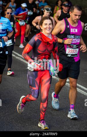 London, UK.  2 October 2022. A costumed runner near Blackfriars take part in the TCS London Marathon.  The 42nd event is this year sponsored by Tata Consultancy Services (TCS).  40,000 elite athletes, club runners and fun runners are taking part in the mass event.  In 2023, the race will return to its usual April date in the calendar.  Credit: Stephen Chung / Alamy Live News Stock Photo