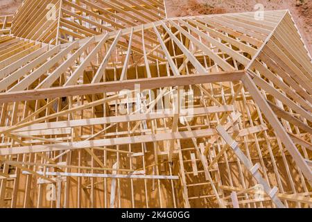 In the process of constructing the roof beams for a new house based on wooden trusses Stock Photo