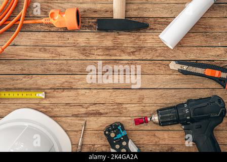 Flat lay composition with different construction tools on wooden background. Stock Photo