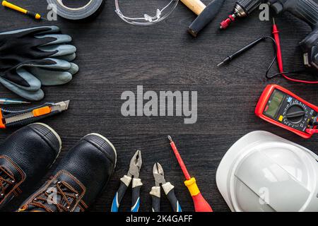 Different electrical tools on wooden background, flat lay. Stock Photo