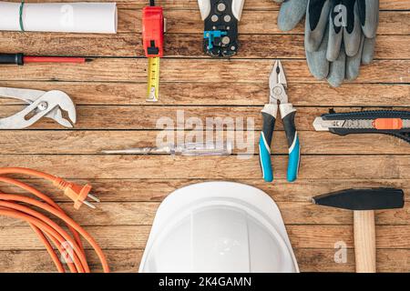Flat lay composition with different construction tools on wooden background. Stock Photo