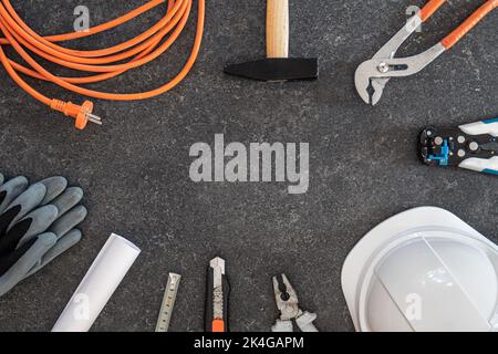 Set of repair tools on textured dark background, flat lay. Stock Photo