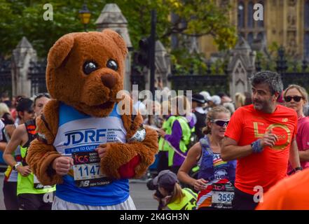 London, UK. 2nd October 2022. A runner dressed as a teddy bear. London Marathon passes through Parliament Square past Big Ben and Houses of Parliament. Credit: Vuk Valcic/Alamy Live News Stock Photo