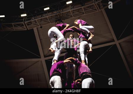 Tarragona, Spain. 2nd Oct, 2022. The 'Moixiganguers d'Igualada' build a human tower during three of the 28th Tarragona Human Tower Competition in Tarragona. The competition takes place every other year and features the main 'Castellers' teams (colles) of Catalonia during a three day event organized by the Tarragona City Hall Credit: Matthias Oesterle/Alamy Live News Stock Photo