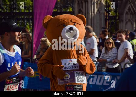 London, UK. 2nd October 2022. A runner dressed as a teddy bear. London Marathon passes through Parliament Square past Big Ben and Houses of Parliament. Credit: Vuk Valcic/Alamy Live News Stock Photo