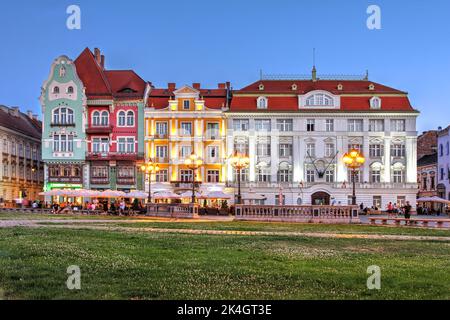 Beautiful row of houses in Piata Unirii (Union Square), Timisoara, Romania during a summer evening. From left to right: Brück House (in art nouveau st Stock Photo