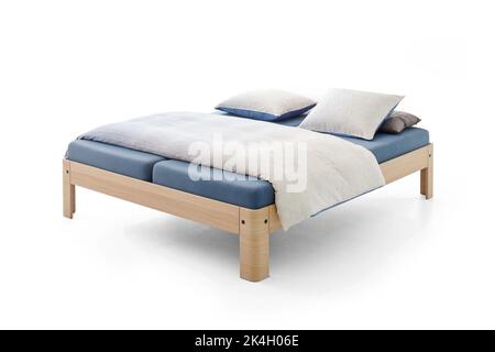 classic bed with a blue leather mattress on a wooden frame, isolated on white Stock Photo
