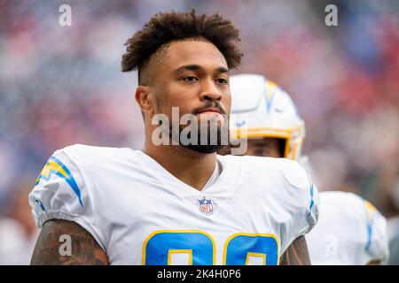 Los Angeles Chargers defensive tackle Sebastian Joseph-Day (69) and  linebacker Troy Reeder (42) tackle Seattle Seahawks quarterback Sean  Mannion (9) in the end zone for a safety during the second half of