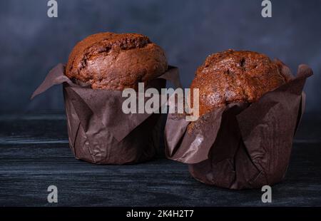 chocolate muffins on a dark background Stock Photo