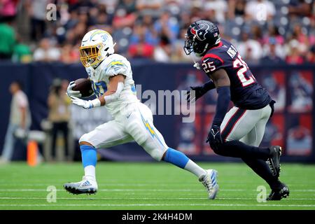 Houston, USA. Houston, Texas, USA. 2nd Oct, 2022. Los Angeles Chargers running back Austin Ekeler (30) carries the ball while Houston Texans cornerback Desmond King II (25) pursues during the second quarter of the game between the Houston Texans and the Los Angeles Chargers at NRG Stadium in Houston, TX on October 2, 2022. (Credit Image: © Erik Williams/ZUMA Press Wire) Credit: ZUMA Press, Inc./Alamy Live News Stock Photo