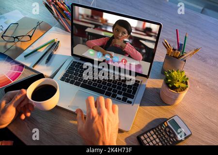 Mid section of female teacher having a video call with male student on ...