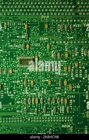 Green computer circuit board with microchips. Stock Photo