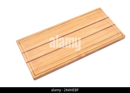 A rectangular shaped wooden cutting board isolated on a white background Stock Photo